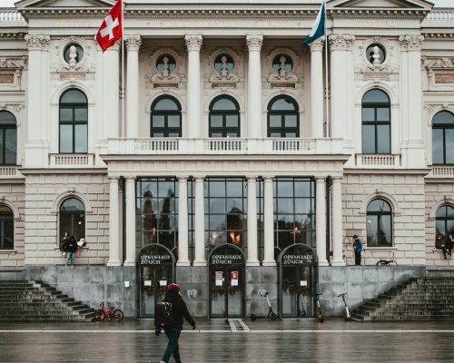 Front view of Zurich Opera House with grand facade, famous landmark at Sechseläutenplatz, popular stop during private city tours