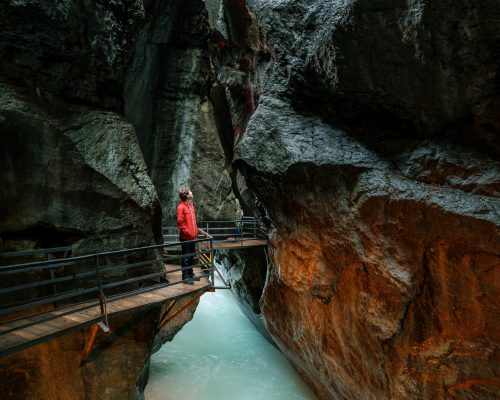 Scenic view inside the Aare Gorge in Switzerland, showing narrow rock formations, turquoise river, and visitor walkway — featured on Zurich Private Tours.